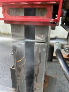 Abrasive waterjet cutting process in action on a sandwich structure.