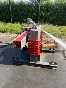 Triple cutting system performing high-pressure abrasive waterjet cutting.